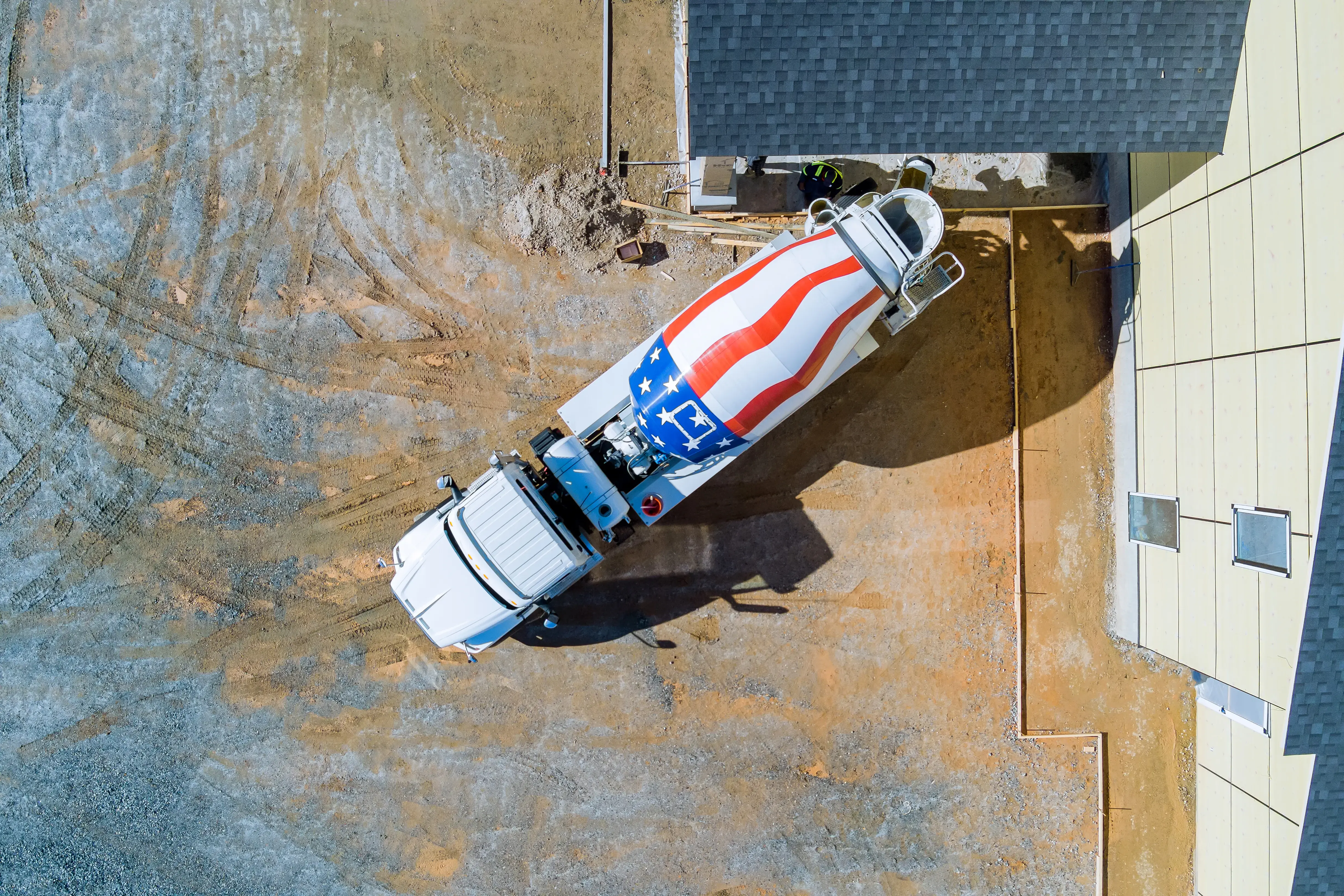 an-concrete-mixing-truck-pour-out-concrete-for-pav-2026-01-09-08-09-07-utc